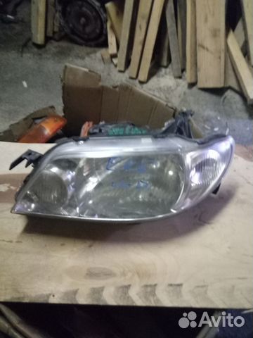 Фара левая mazda familia BJ5W 2002-2003 год Фара левая mazda familia BJ5W 2002-2003 год
