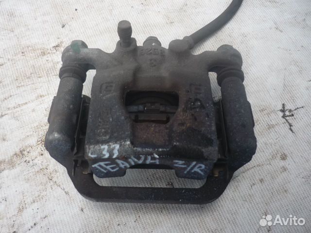 Суппорт тормозной задний LH/RH Nissan Teana L33