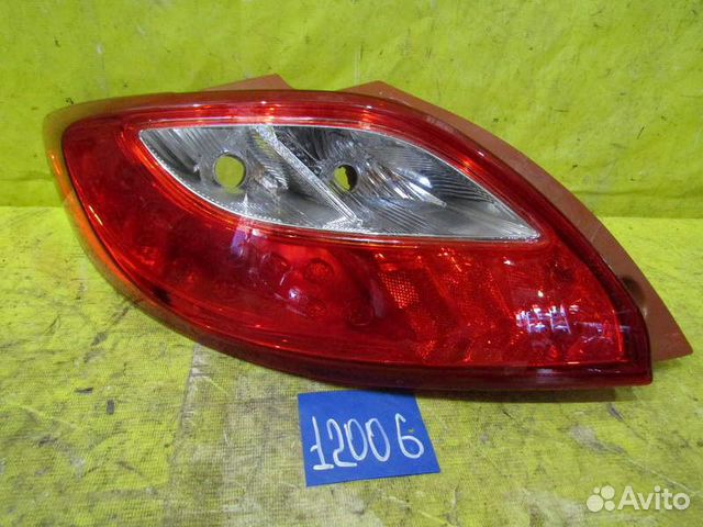 Фонарь левый Mazda Demio 11-15г 12006